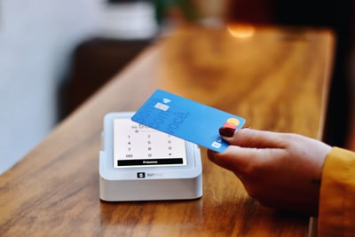 Customer paying by card at a billing counter