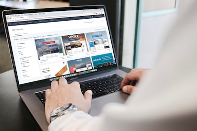 Person reviewing a website layout on a laptop