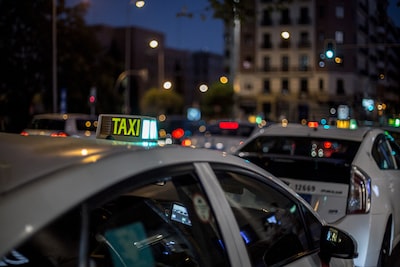Taxi cab on a city road at night