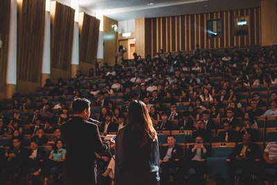 Audience at a formal award ceremony in an auditorium