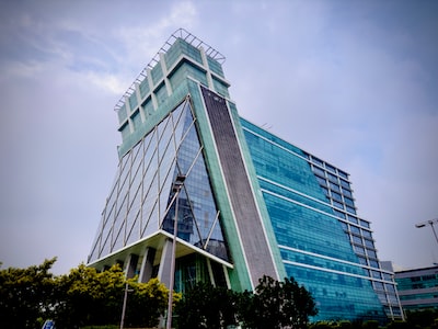 Glass office towers of DLF Cyber City in Gurugram against a clear sky