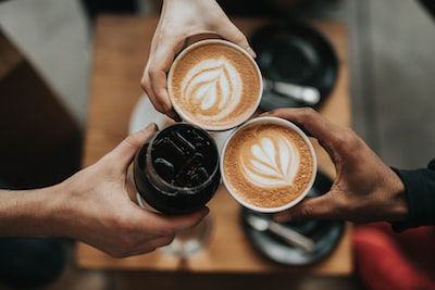 Colleagues sharing coffee and conversation around a table