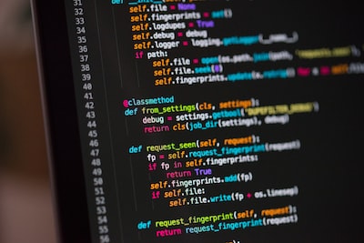 Source code in a dark-theme editor on a monitor