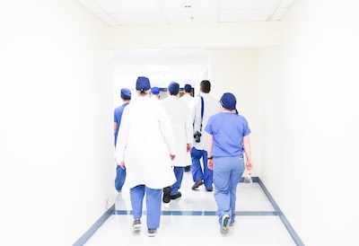 Doctors and medical staff walking down a hospital corridor