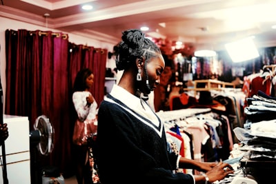 Shopper browsing racks in a clothing store