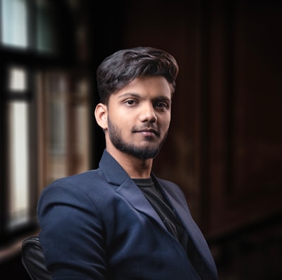 Portrait of a young man in a dark suit jacket