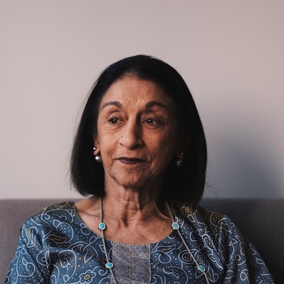 Portrait of a smiling woman in a blue top